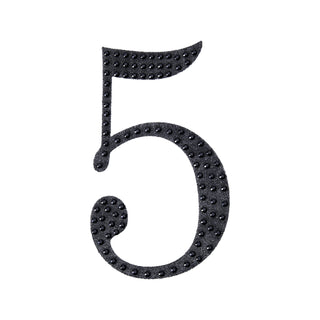 Black decorative number five with textured dots on a white background.