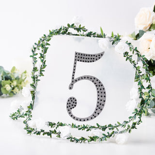 Decorative table number sign with floral border, featuring the number 5.