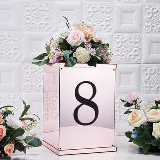 Rose gold table number display with floral arrangement, number 8.