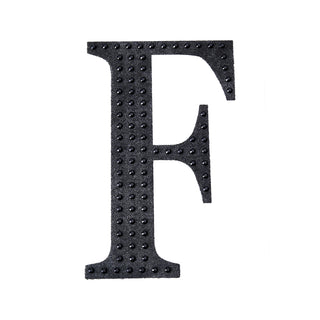 Black textured letter F on a plain white background