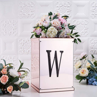 Floral display box with letter 'W' and assorted flowers