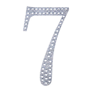 Silver glitter number 7 cutout on a white background