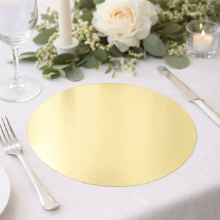 Gold round placemat on a beautifully set dining table with floral accents.