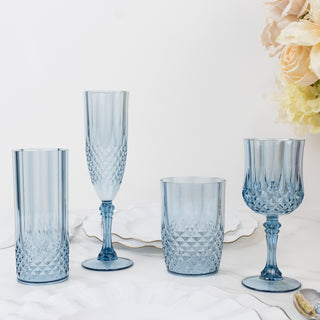 Blue crystal glassware set on a plain backdrop.