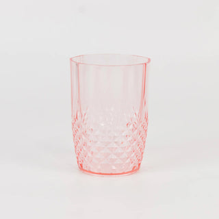 Pink diamond-patterned tumbler on white background