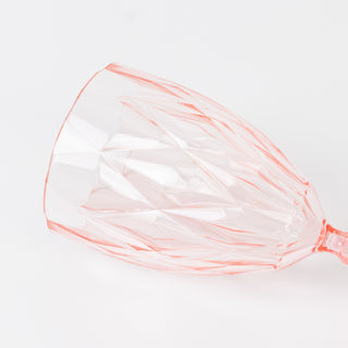 Pink crystal wine glass with a faceted design