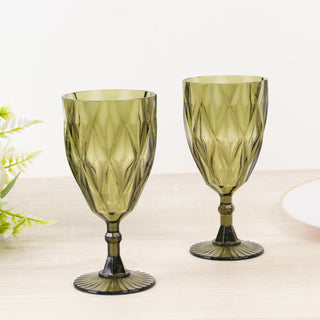 Green decorative glasses with a diamond pattern, set on a light surface.