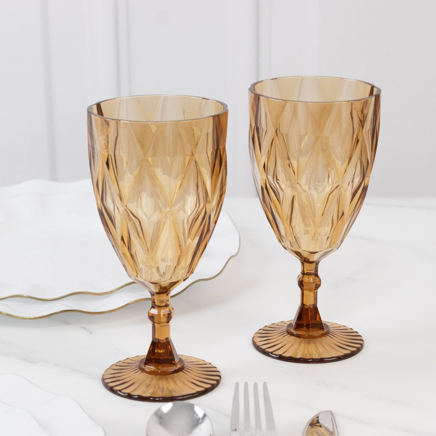 Amber glass goblets with textured design, perfect for elegant dining.