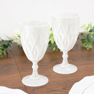 Elegant white plastic goblets for outdoor or casual dining.