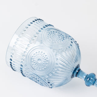 Blue decorative glass goblet with intricate design details.