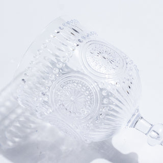 Cut glass dessert cup with intricate detailing and a fluted design.