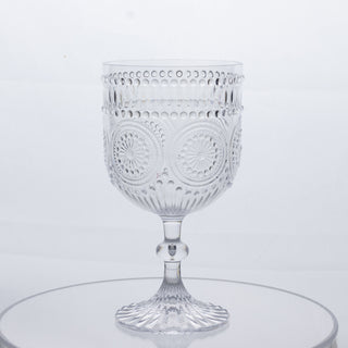Decorative crystal goblet with intricate design and pedestal base.