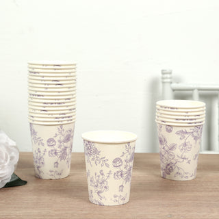 Floral design paper cups stacked on a wooden surface.