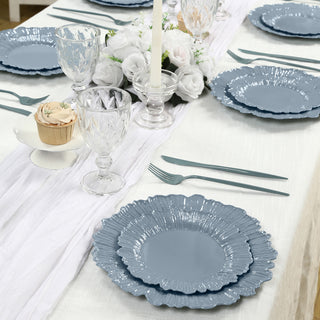 Elegant blue scalloped plates set on a beautifully arranged dining table.