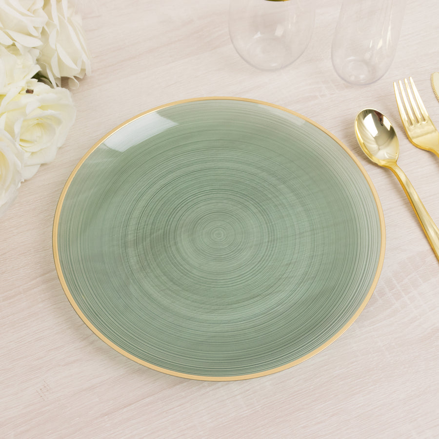 Green decorative plate with gold rim on a light wooden table.