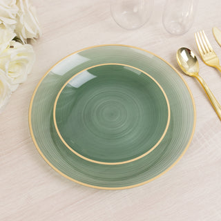 Green decorative plate with gold trim on a light wooden table.