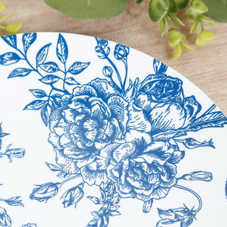 Blue floral design plate with intricate detailing on a white background.