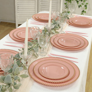 Elegant pink dinnerware set on a beautifully arranged dining table.