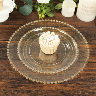 Elegant glass serving plates with beaded edges, styled with a cupcake.
