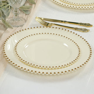 Elegant cream plates with gold beaded rim, perfect for formal dining.