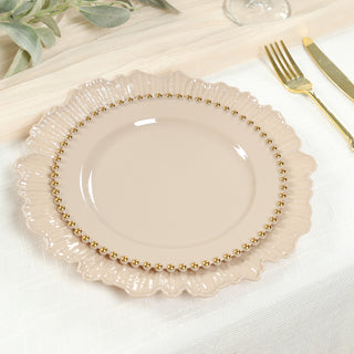 Elegant beige plate with gold bead trim on a textured table setting.