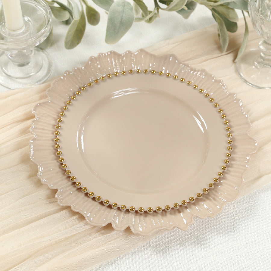 Elegant beige plate with a ruffled edge and gold beaded trim.