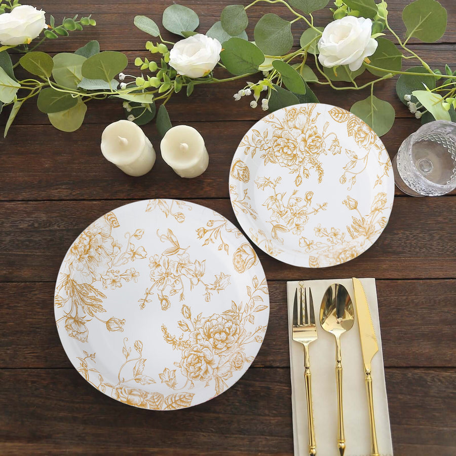 Elegant floral dinner plates with gold accents, styled with cutlery and decor.