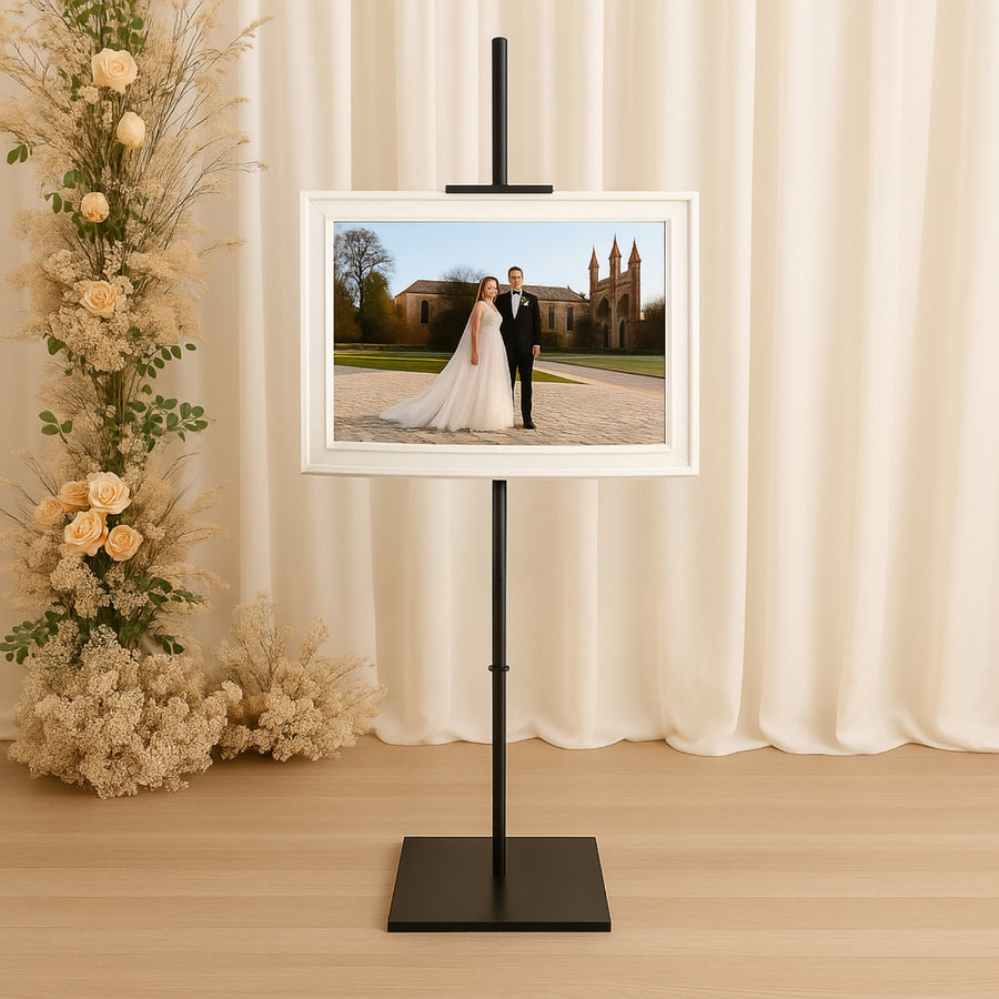 Elegant photo frame on an easel displaying a wedding portrait.