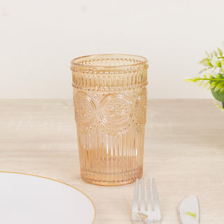 Decorative pink glass tumbler on a dining table.