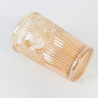 Decorative vintage glass tumbler in soft peach color