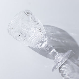 Clear vintage glass goblet on white background