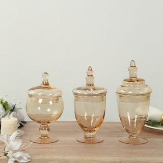 <strong>Decorative Set of 3 Amber Gold Apothecary Glass Jars</strong> <strong>Decorative Set of 3 Amber Gold Apothecary Glass Jars</strong>