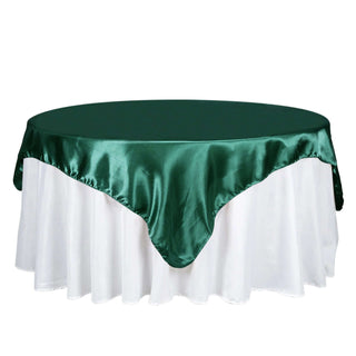 Add Elegance to Your Event with the 72" x 72" Hunter Emerald Green Satin Square Tablecloth Overlay Add Elegance to Your Event with the 72" x 72" Hunter Emerald Green Satin Square Tablecloth Overlay