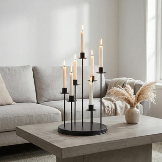 Modern living room with lit candle holder centerpiece on concrete coffee table