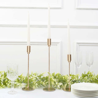 Add Elegance to Your Space with the Gold Metal Taper Candle Holder Set Add Elegance to Your Space with the Gold Metal Taper Candle Holder Set