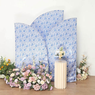 Decorative floral backdrops with a pedestal and flowers in a studio setting.