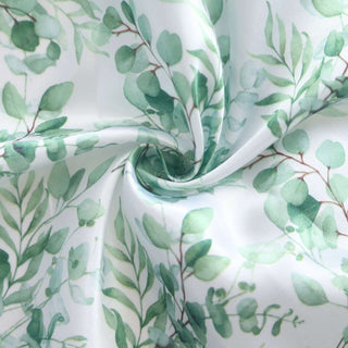 Green eucalyptus leaf fabric with a swirl pattern.