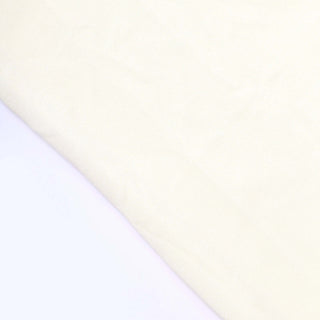Cream textured fabric swatch on a white background.
