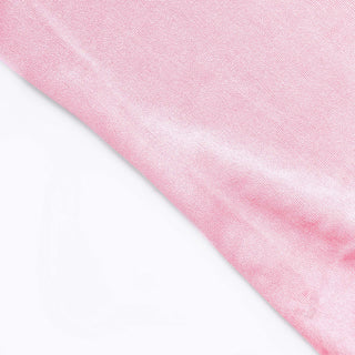 Close-up of soft pink fabric texture.