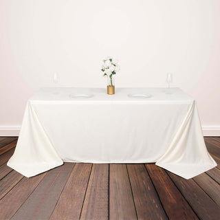 Elevate Your Event with the Ivory Scuba Wrinkle Free Rectangular Tablecloth Elevate Your Event with the Ivory Scuba Wrinkle Free Rectangular Tablecloth