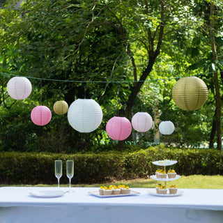 Colorful paper lanterns hanging outdoors at a festive event.