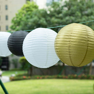 Colorful paper lanterns hanging outdoors for festive decoration.