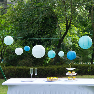 Decorative hanging lanterns in shades of blue at an outdoor event.