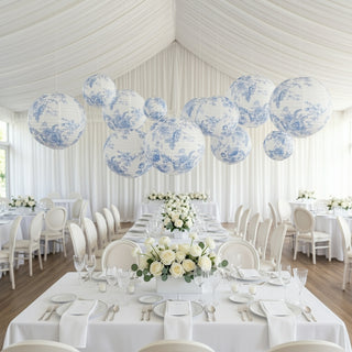 Elegant blue and white decorative lanterns in a beautifully arranged dining space.