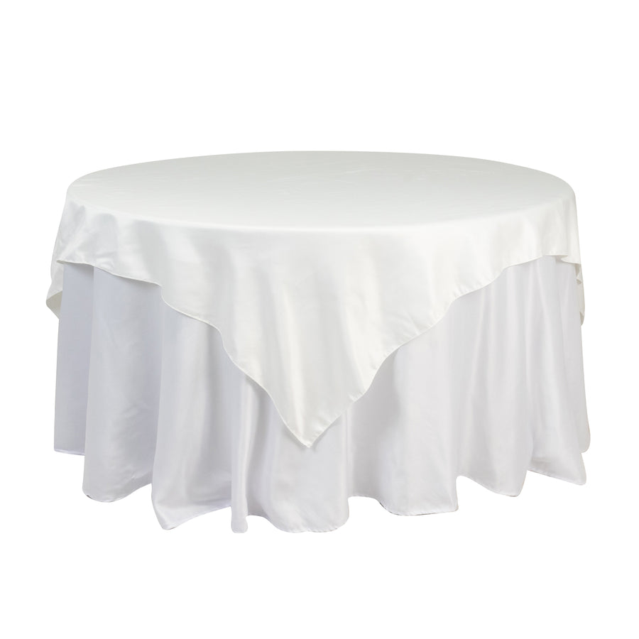Round white tablecloth with elegant draping for events and dining.
