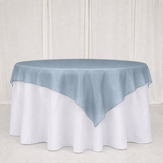 Light blue round tablecloth overlay on a white banquet table