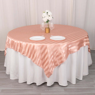 Elevate Your Event with the Dusty Rose Satin Stripe Table Overlay Elevate Your Event with the Dusty Rose Satin Stripe Table Overlay