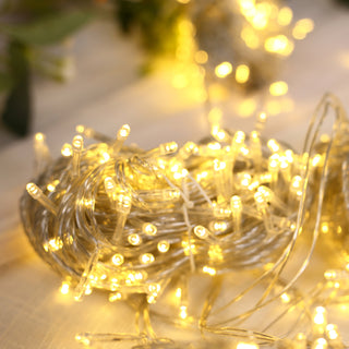 Warm white LED fairy lights on a soft background.