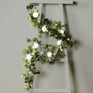 <strong>Fake Eucalyptus Garland with Ivory Roses & Fairy Lights</strong> <strong>Fake Eucalyptus Garland with Ivory Roses & Fairy Lights</strong>