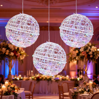 Decorative hanging light orbs in a beautifully arranged event space.
